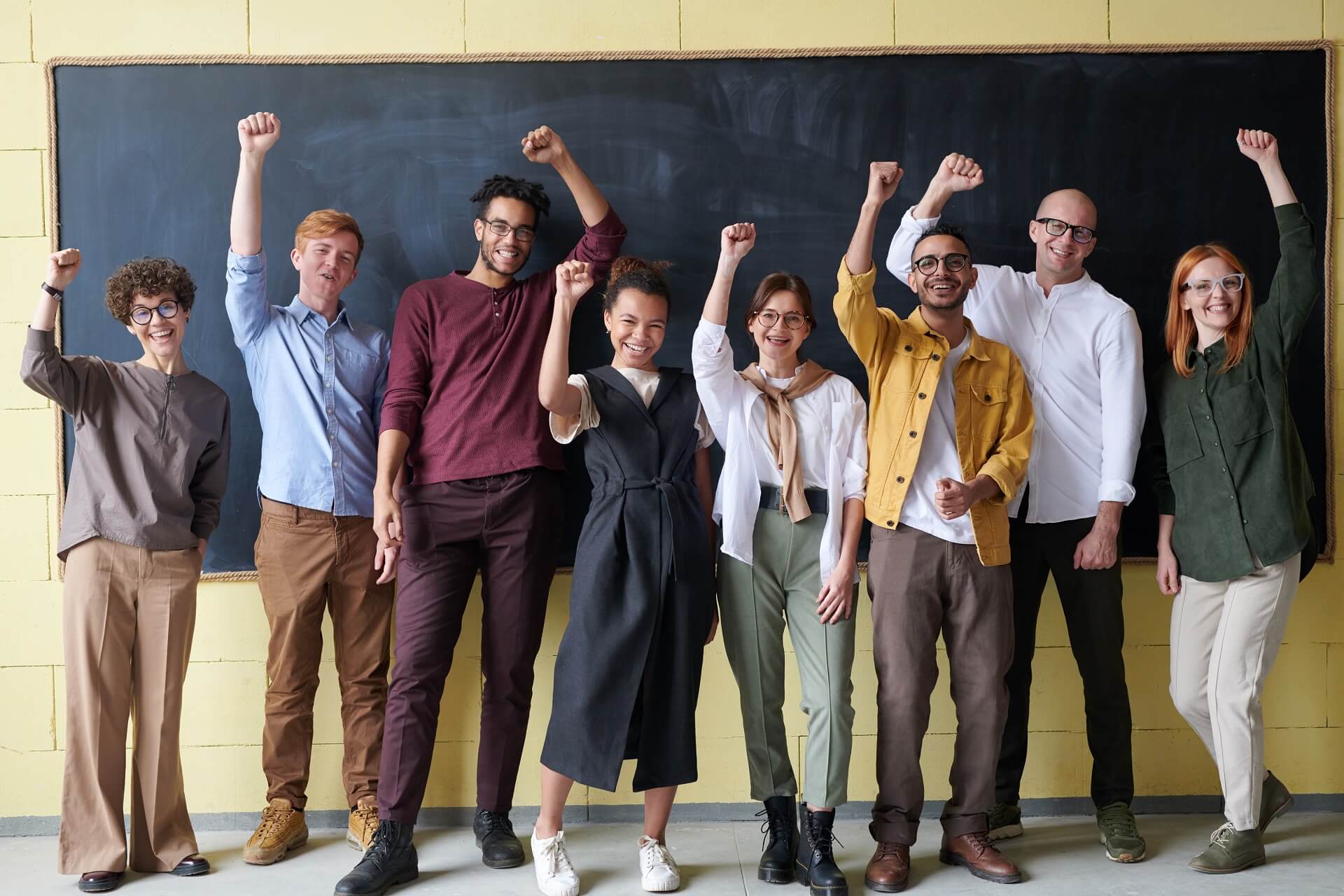 A group of happy co-workers cheering