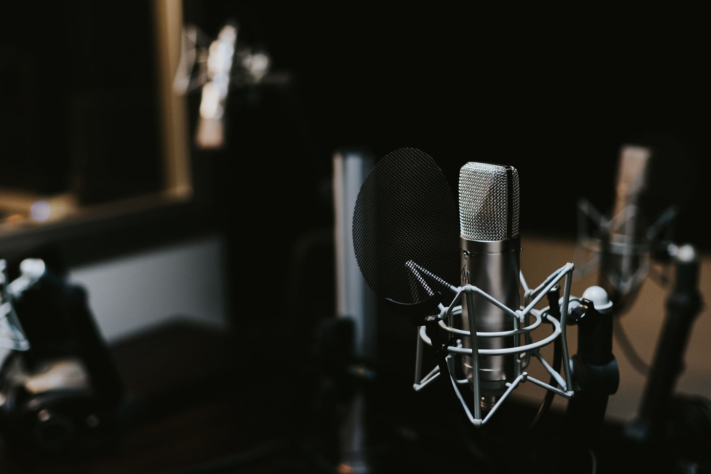 An image of a sound studio and microphones